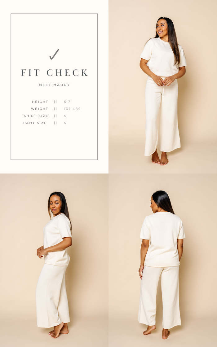 fit check graphic that shows maddy and the size she is wearing size small in the knit women's short sleeve tee and wide leg pants.