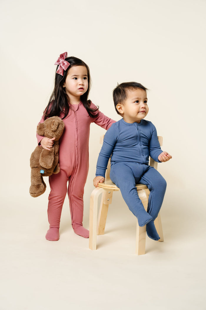 Marjorie Zipper Footies Harrison Zipper Footies toddler girl standing toddler boy sitting in chair